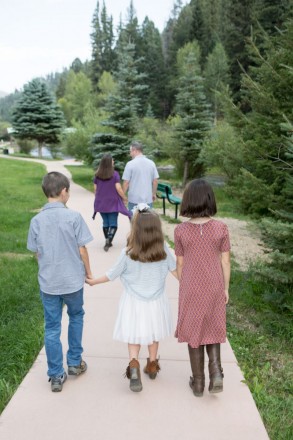 McCully family enjoys walk behind convention center in Red River
