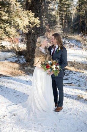 Traditional photo of Amberly and Kyle after their Red River wedding ceremony