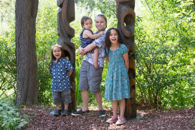 Siblings smiling together for pictures at sculpture garden in Arroyo Seco