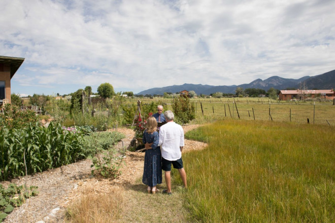 Under a large sky, standing next to the corn, Susan and JR were married by Dan Jones of Embracing Ceremony.