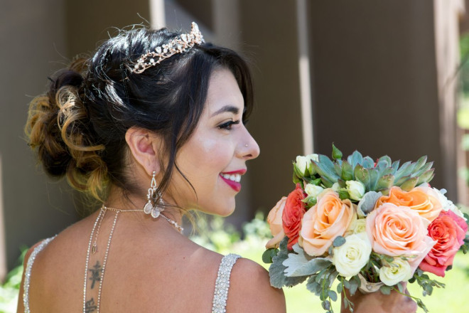Monica with her nose ring and professional bouquet with roses and succulents.