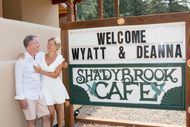 Deanna and Wyatt are welcomed by Shady Brook sign in Taos Canyon