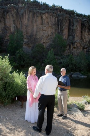 The magnificent gorge towers over thei small vow renewal ceremony in Taos gorge