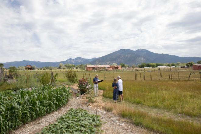 Albuquerque couple is married by officiant who is socially distanced from bride and groom.