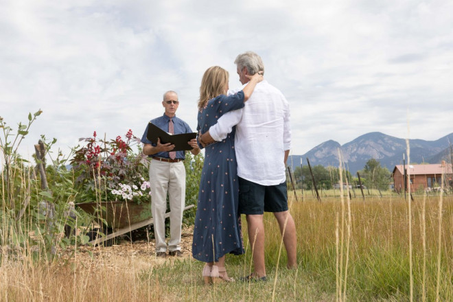 Wheelbarrow of flowers for wedding altar at private ceremony in Taos, NM.