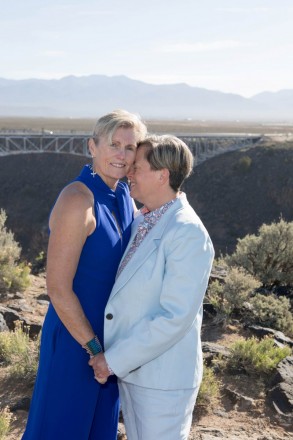 Women in blue are married at Rio Grande national monument in Taos, NM