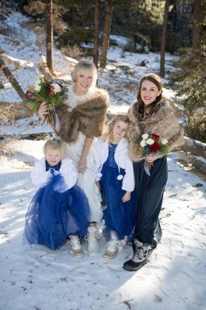 Amberly and her girls: flower girl daughters and bridesmaid, all in snow boots
