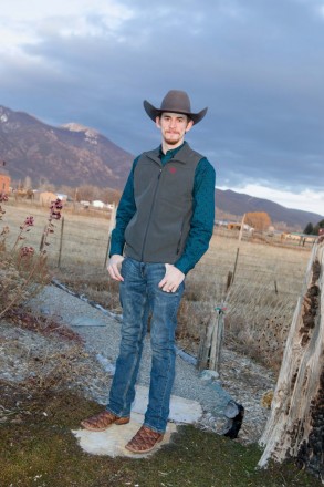 Groom with cowboy hat and Taos mountain