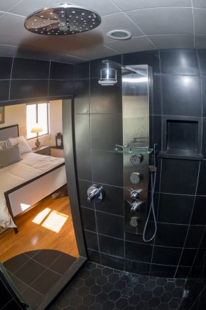 Black steam shower and sauna in master bedroom at Taos, NM condo
