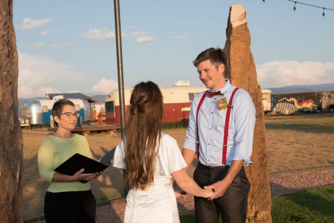 Elopement package with bride and groom and officiant at local Taos venue