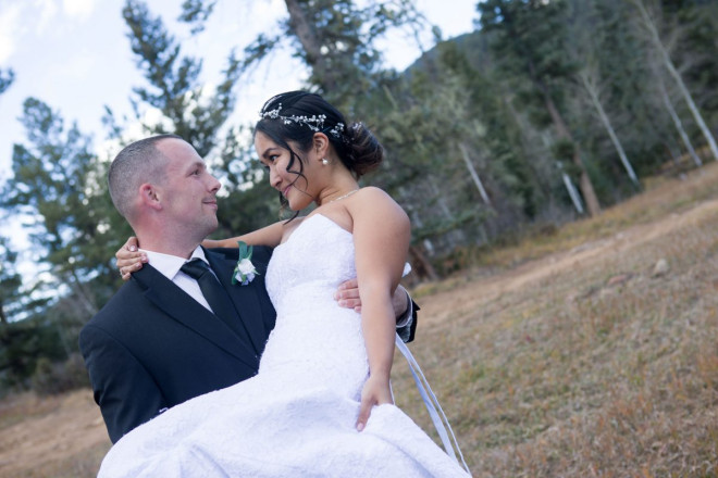 Matthew holds Chisato in the mountains of Taos Canyon