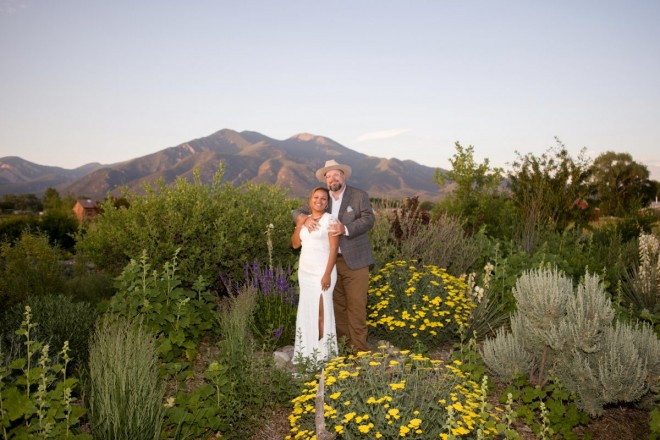 Radiant Taos mountain with stunning bride and groom at July wedding