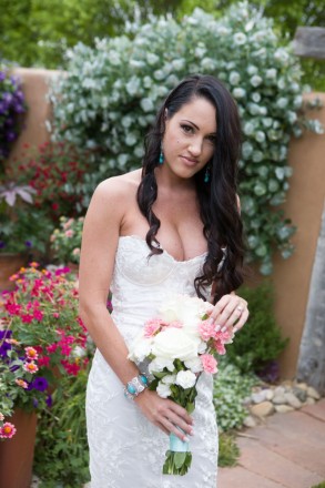 Bride wears turquoise jewelry in private flower garden for Elopement