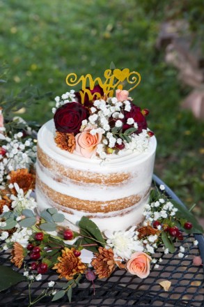 Semi Naked cake with fresh flowers and wedding topper