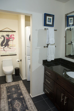 Bathroom with washer and dryer in quaint Taos condo