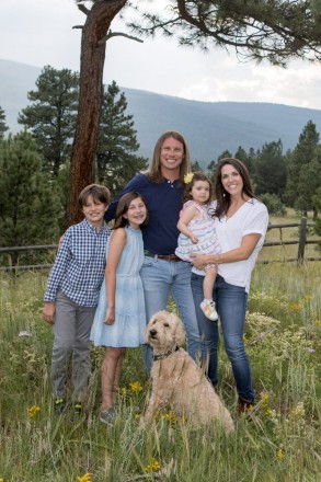 Happy family on vacation at Trail's End in Angel Fire, dogs included