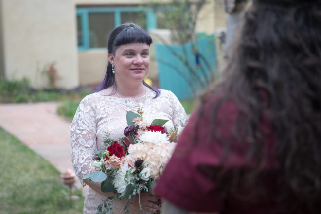 April's stunning blue eyes that match the Taos-blue gate and window pane.