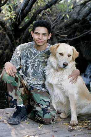 Penasco high school senior with his favorite dog friend