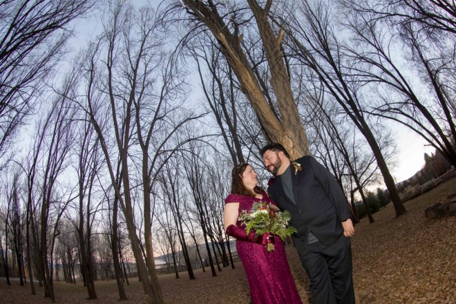 Crisp leaves underfoot as we catch the dusk and the bare trees in this December wedding