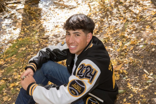 Jacob smiles for his senior pictures session in Red River, NM