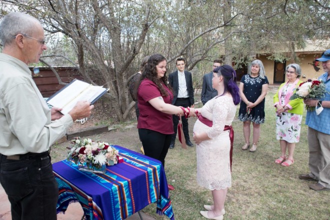 Intimate same-sex wedding ceremony at Hacienda del Sol with two brides