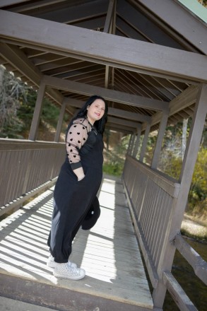 Katy smiles with her hand in her pocket during her Red River senior picture session