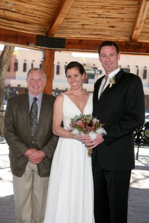 Bride and groom and her father in important after-wedding photography