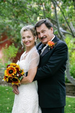 Nontraditional older bride and groom at formal autumn wedding