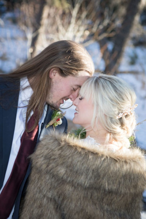 Amberly and Kyle share an intimate moment during their wedding photography session in Red River