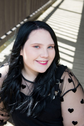 Senior pictures on covered bridge in Red River, NM