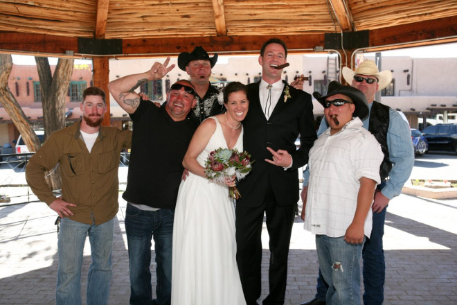 Altar photo of "the guys" honoring the groom's new bride; adobe and chiles in background