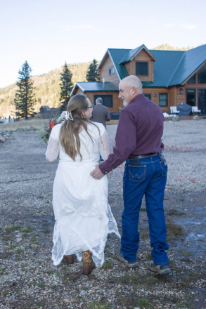 Joe carries Celeste's dress as they walk back to Almost Heaven