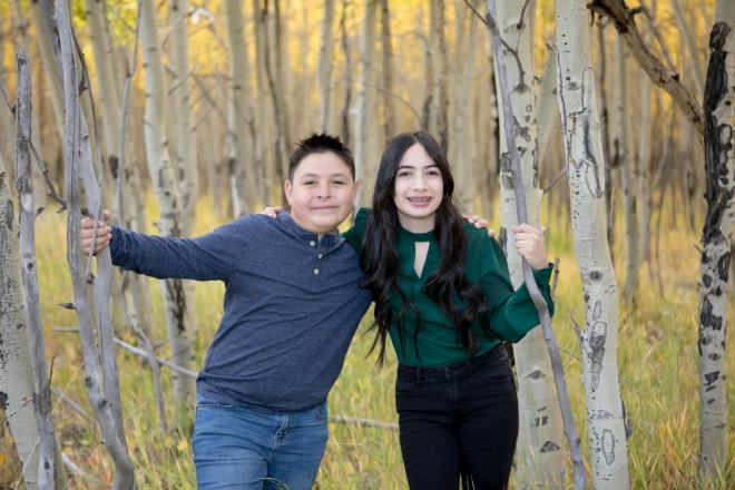 Siblings pose for photo shoot during family photo session