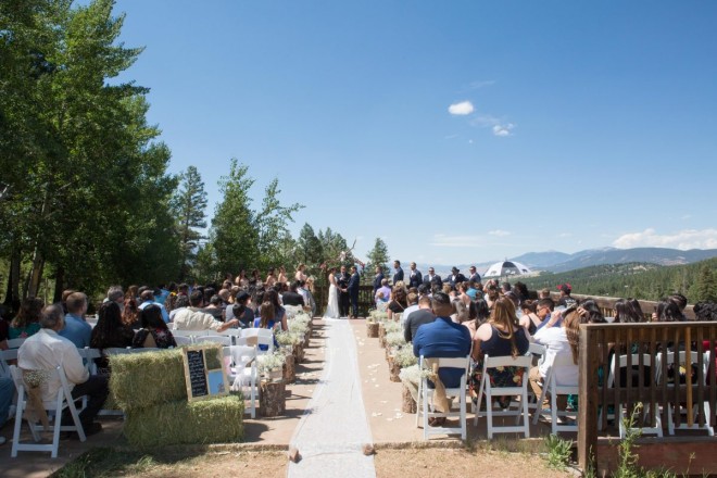 Gorgeous wedding with large wedding party at Angel Fire resort's wedding site that overlooks the Village of Angel Fire.