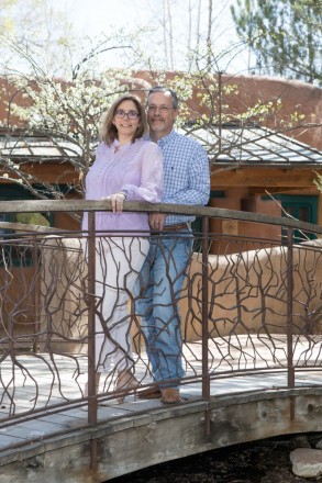 Handcrafted bridge and apple blossoms adorn this couple's Easter photo