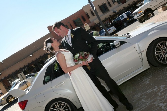 After a wedding on Taos plaza, these lovebirds are ready to drive off to the mountains