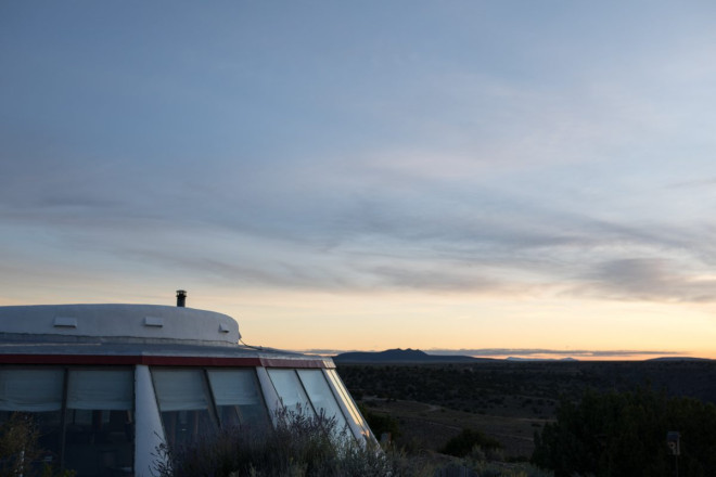Earthship in El Prado at Dusk with Three Peaks in Background