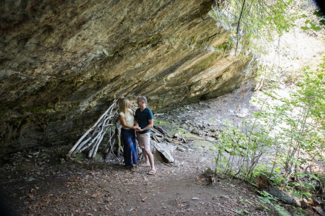 Deanna and Wyatt next to the shelter that has been constructed in the cave.