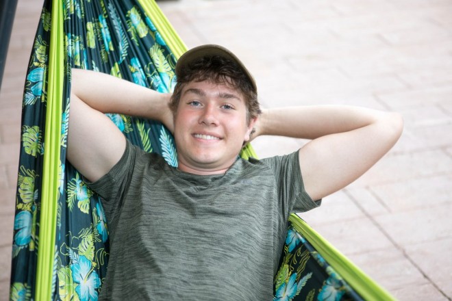High school senior, William, relaxes after his senior photos at the Taos Ski Valley