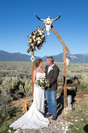 Chasity and Bill smile at one another after their September wedding