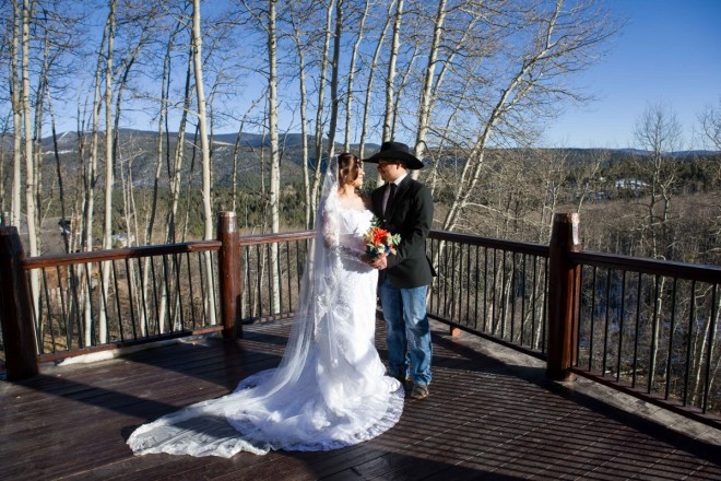 Wintertime wedding in Angel Fire with aspen trees and mountains
