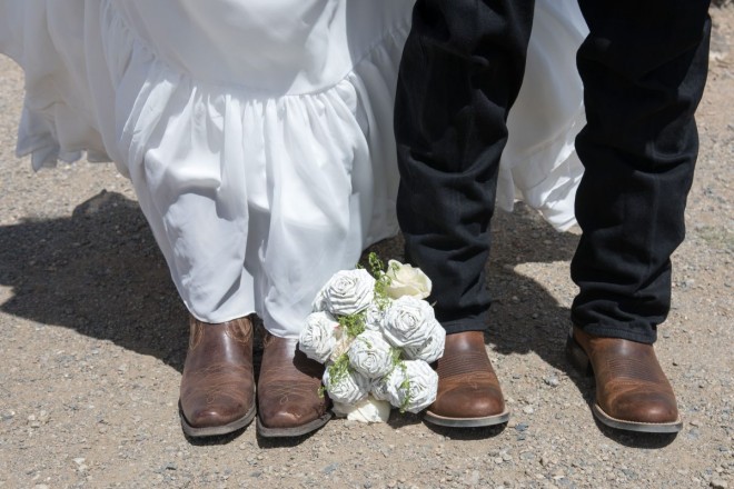 Brown wedding boots, Levis, and paper origami flowers