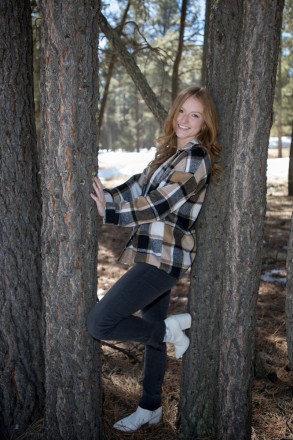 Senior girl poses for her portraits on vacation in Angel Fire, NM