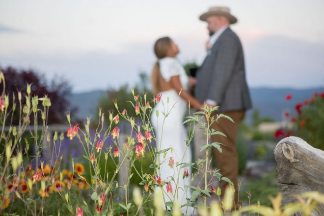 Flowers and mountain silhouettes adorn this Taos garden wedding venue
