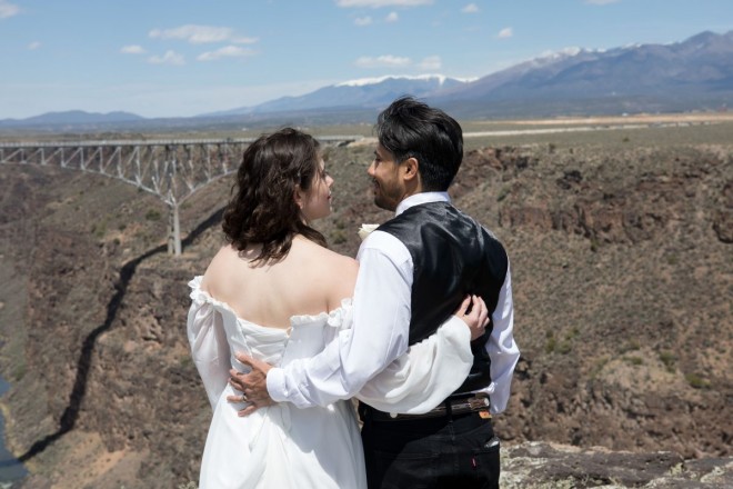 Mackenzie and Steven look over the vast opening of the Rio Grande gorge overlooked by Sangre de Cristo mountains