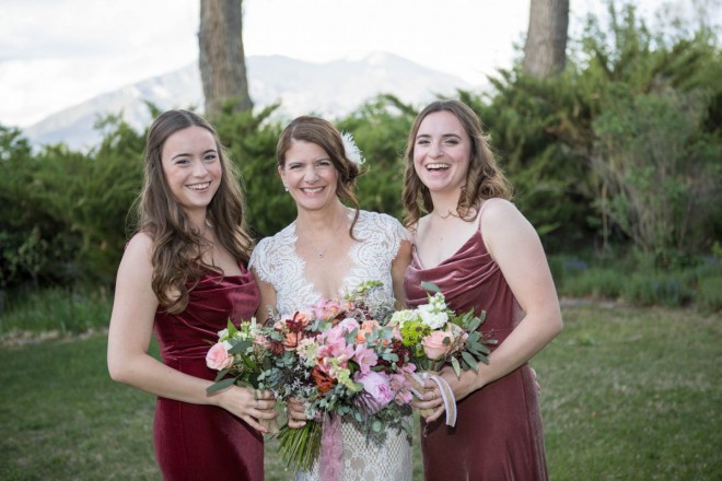 Lindsay laughs with her two bridesmaids daughters