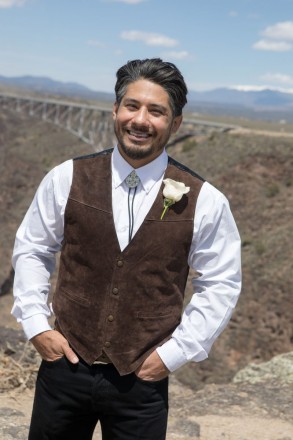 Groom, Steven, dressed in brown leather vest with bolo tie