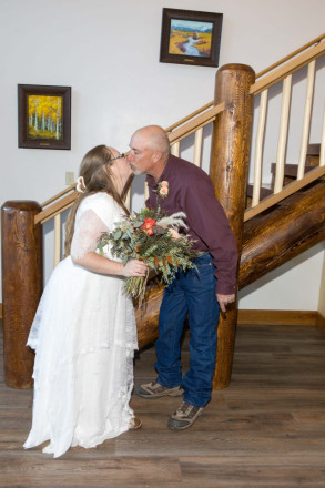 Celeste and Joe warm up with a kiss inside of Almost Heaven in Red River