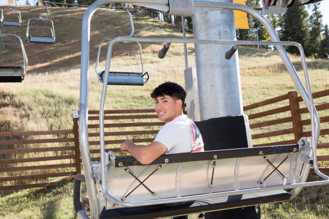 Jacob chills in a chairlift during his Red River photo shoot
