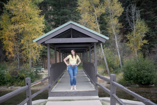 The covered bridge in (and over!) Red River is framed by golden aspens.